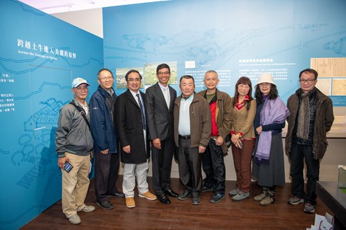 Guests posing in front of the “Hakka History of Dongshi & Zhuolan” exhibition site