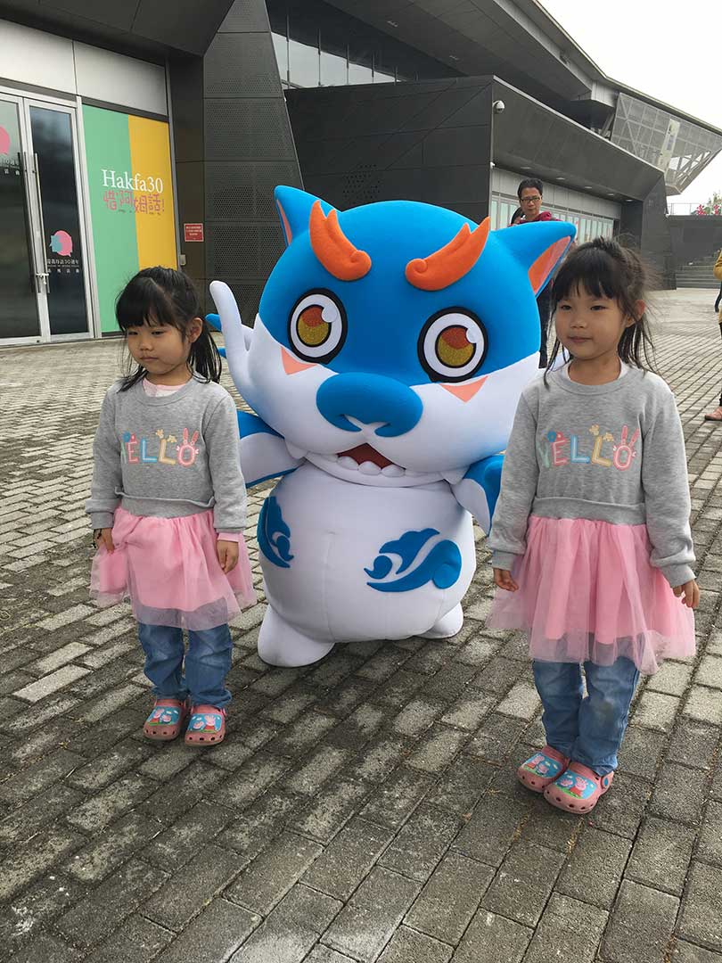 Hagu takes a photo with two small fans