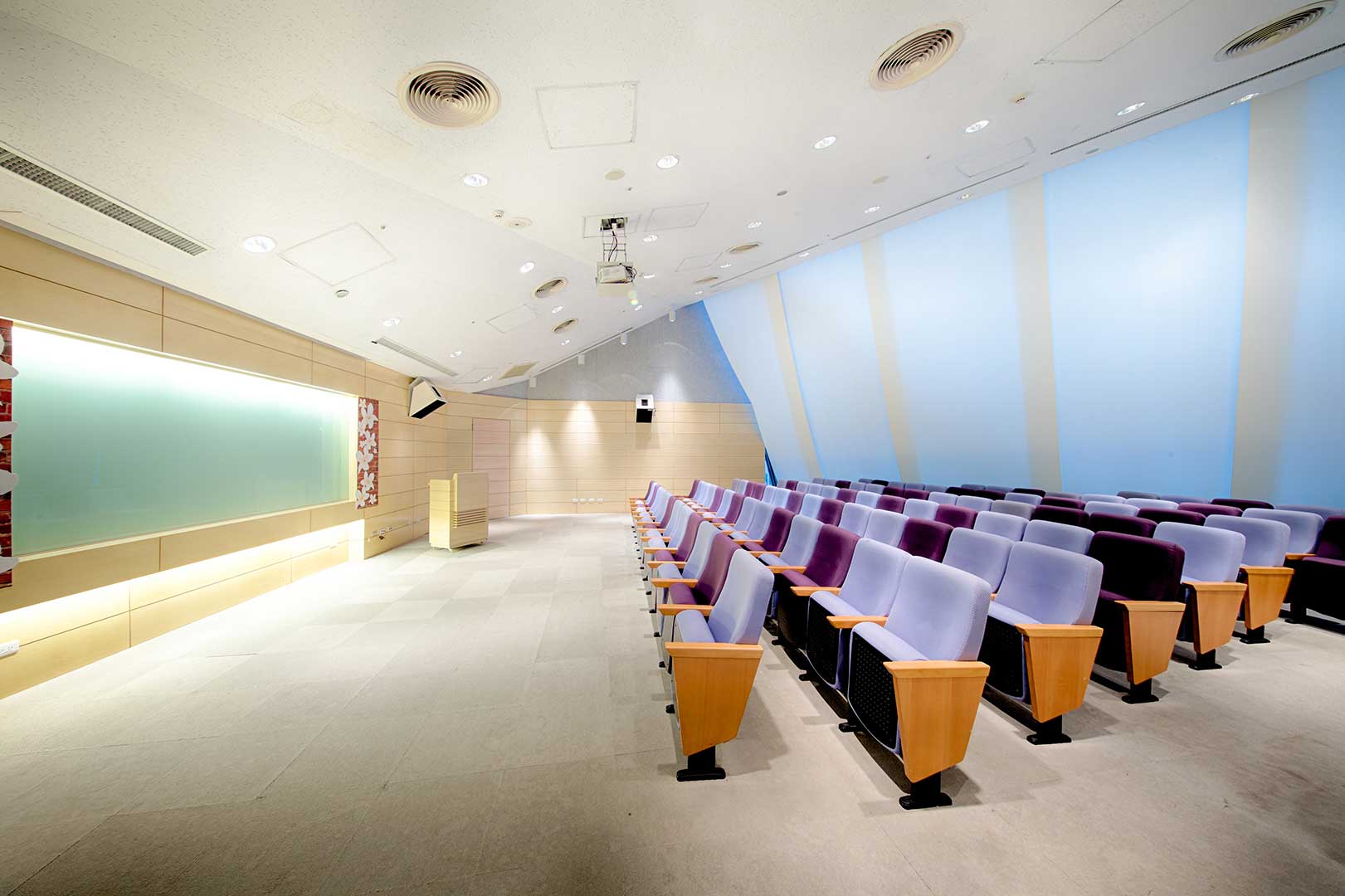Presentation room podium and approximately 57 seats